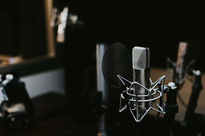 Sound waveform pulsing rhythmically against a dark background
